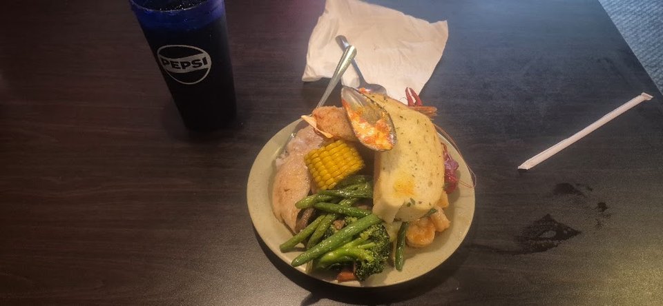 Breakfast buffet plates with coffee nearby.